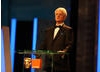 Tim Corrie makes his opening address at the top of the show. (Pic: BAFTA/Stephen Butler)