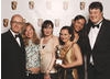 Adrian Edmondson with the winners of the New Media Developer category.