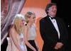 Dakota Fanning, Carey Mulligan and Stephen Fry on stage at the 2010 Britannia Awards.