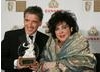 Host Craig Ferguson and honoree Dame Elizabeth Taylor meet on the red carpet