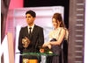 Dev Patel (Slumdog Millionaire) and Talulah Riley (St Trinian's) announce the Costume Design winner. (Pic: BAFTA/ Stephen Butler)