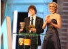 Jesse Eisenberg (The Social Network) and Jennifer Lawrence (Winter's Bone) announce the Special Visual Effects winner. (Pic: BAFTA/ Stephen Butler)