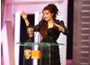 Helena Bonham Carter accepts the BAFTA for her role in The King's Speech. 