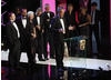 Jonathan Young, Tim Key and Kevin Rundle joined The Bill cast memebers Amita Dhiri (DC Grace Dasrai) and Chris Simmons (DC Mickey Webb) on stage to accept the Continuing Drama BAFTA - the first time the soap has won the award (BAFTA / Marc Hoberman).