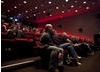 Audience members listen to a discussion about producing VFX on a low budget.