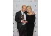 Brian Cant celebrates winning the BAFTA Special Award with his wife Cherry. Pic: BAFTA/Richard Kendal