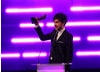 TV Presenter Alex Zane accepts the BAFTA for Debut Game on behalf of the winning team behind Insanely Twisted Shadow Planet.