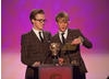 Band members Tom Fletcher and Dougie Poynter of McFly share the stage to present the award for Entertainment.