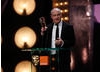Barry Ackroyd accepts the award for Cinematography for this work on The Hurt Locker (BAFTA/Brian Ritchie).