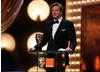 Colin Firth, nominee in the Leading Actor category for A Single Man, presents the first award of the evening, for Outstanding Debut by a British Writer, Director or Producer (BAFTA/Brian Ritchie)
