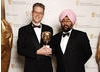 Joby Gee celebrates his Editing Factual win for The Fallen with comedian Hardeep Singh Kohli (BAFTA / Richard Kendal).
