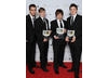 Harry Potter star and BYGD ambassador Matthew Lewis with Dan Pearce, Sam Taylor and James Cook, who won for their work on HAMSTER: Accidental World Domination. Pic: BAFTA/Richard Kendal