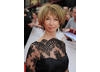 Coronation Street star Helen Worth arrives on the red carpet outside the London Palladium (BAFTA/Richard Kendal).