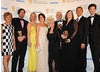 The cast of EastEnders receive the Continuing Drama BAFTA from Chris Addison (BAFTA/Richard Kendal).