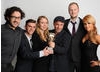 Presenter Aliona Vilani with the winning team behind Seeking Refuge, including Andy Glynne.