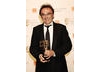 Danny Boyle was exceptionally pleased to crown a night of Slumdog Millionaire success by taking the Best Director award (BAFTA/ Richard Kendal).
