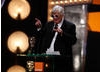 Joe Dunton dons a pair of 3D glasses after receiving the honour for Outstanding British Contribution to Cinema award (BAFTA/Brian Ritchie).