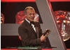 Graham Norton switches temporarily from ceremony host to gracious winner.