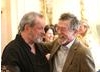 Terry Gilliam and John Hurt catching up at the special BAFTA event at Savoy, London.