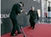 Mark Kermode receives the winner's envelope from Andy Serkis in ceremonial fashion.