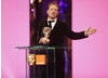 And the BAFTA goes to... Slumdog Millionaire makes it five BAFTAs for the first nine categories as Simon Beaufoy collected the Adapted Screenplay Award (BAFTA / Marc Hoberman).