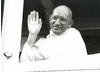 Mahatma Gandhi (Ben Kingsley) waves farewell as the steamship taking him to London gets underway in Bombay.