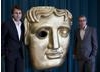 Actor Matthew Lewis poses with NESTA's Education Programme Director; Benedict Arora in front of the BAFTA mask. (Photography: Ed Miller)