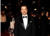 Slumdog Millionaire's gameshow host, Anil Kapoor, arrives to present the Costume Design category with Claire Danes (BAFTA/Richard Kendal).