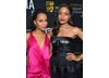 Actress Kerry Washington and Bond star Naomie Harris strike a red carpet pose.