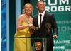 Eastenders stars Laurie Brett and John Partridge present the BAFTA for Comedy Programme. (BAFTA/Steve Butler)