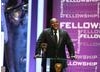 Actor and comedian Lenny Henry presents the Academy Fellowship broadcaster Melvyn Bragg. (BAFTA/Steve Butler)