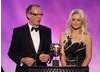 Inbetweeners star Emily Atack and legendary video game artist Dave Gibbons present the Award for Artistic Achievement (BAFTA/Brian Ritchie)