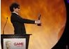 Alex Zane eagerly hands over the award for Gameplay category (BAFTA/Brian Ritchie)
