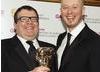 EA Games' Jon Goddard and Guy Perkins celebrate their BAFTA in the Multiplayer category for Left for Dead 2 (BAFTA/Steve Butler). 