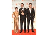 Presenters Christina Ricci and Jeremy Irvine with writer and director Michel Hazanavicius. Christina Ricci wears a gown designed by Givenchy and Jeremy is wearing a suit by Burberry. 