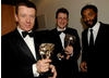 Chiwetel Ejiofor (right) with Peter Morgan and Jeremy Brock, winners of the BAFTA for Adapted Screenplay for The Last King of Scotland (BAFTA / Liam Daniel).