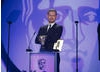The British Actor, perhaps best known for his role as Nick Tilsley in Coronation Street presents the Visual Effects Award. (Pic: BAFTA/Jamie Simonds)