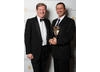 Special Award recipient Aidan Farrell celebrates his award with presenter Adrian Dunbar.