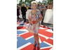 The Shameless and Brookside actress arrives on the union jack carpet.