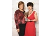Winner of the Production Design BAFTA for Gracie!, Claire Kenny, with category presenter, actress Lynda Bellingham.