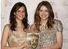 Skins stars Kaya Scodelano and Hanna Murray celebrate their win in the only category voted for by the public, the Philips Audience Award (BAFTA/ Richard Kendal).