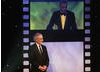 Steven Spielberg watches Daniel Day-Lewis make his acceptance speech. 