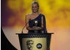The Gadget Show presenter announces the Video Game winner. Pic: BAFTA/Steve Finn