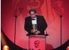 Jason Savage accepts this award for his work editing the factual television programme Human Planet (Arctic). (Pic: BAFTA/Jamie Simonds)
