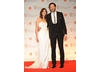 Bridesmaids stars Chris O'Dowd and Kristen Wiig presented the Outstanding Debut BAFTA to director Paddy Considine for his film, Tyrannosaur. O'Dowd is in Hackett, Wiig is wearing Alberta Ferretti.