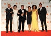 New Bond girls Berenice Marlohe and Naomie Harris with producer Eric Fellner, director Tomas Alfredson and producers Robyn Slovo and Tim Bevan.