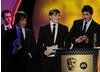 Dan Pearce, Sam Taylor and James Cook of Beached Whale Productions take the BYGD award for their game HAMSTER: Accidental World Domination. Pic: BAFTA/Steve Finn