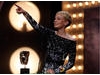 Carey Mulligan acknowleges her father and brother in the audience as she gives her acceptance speech for the Leading Actress award for her performance in An Education (BAFTA/Brian Ritchie).