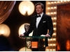 Colin Firth, nominee in the Leading Actor category for A Single Man, presents the first award of the evening, for Outstanding Debut by a British Writer, Director or Producer (BAFTA/Brian Ritchie)