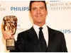 Simon Cowell poses with his Special Award BAFTA (BAFTA/Richard Kendal).